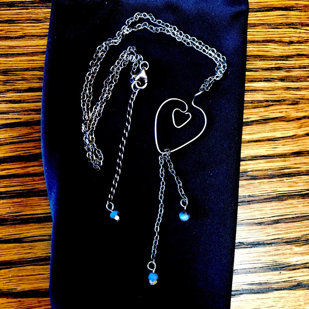Jody Coyote Silver Wire Art necklace.
